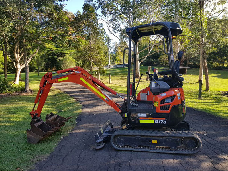 Kubota U17-3 mini excavator on its plant trailer, ready for hire on the Sunshine Coast